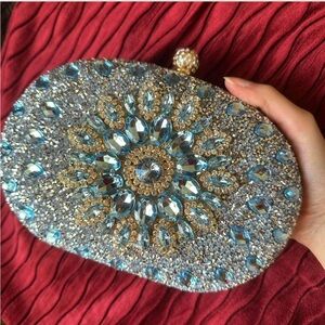 Baby light blue and gold rhinestone clutch bag